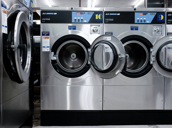 Row of commercial washing machines